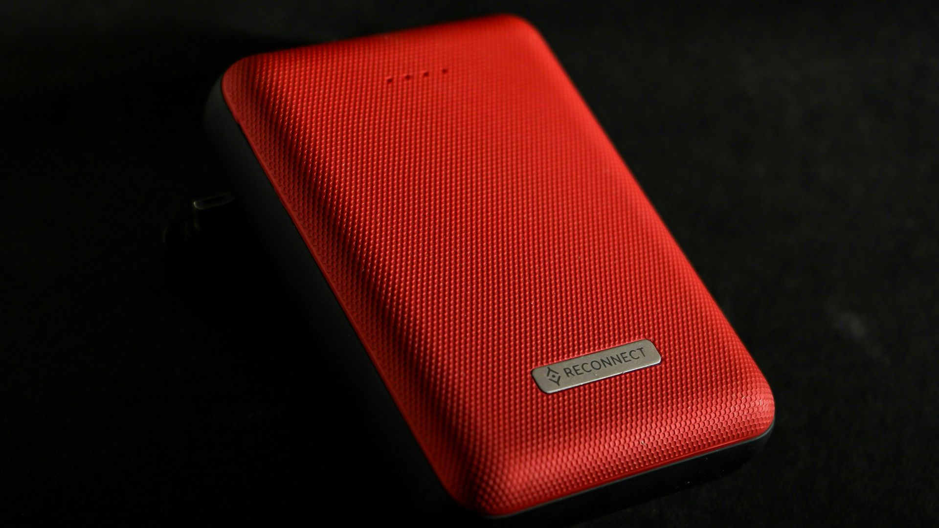 red leather case on black surface