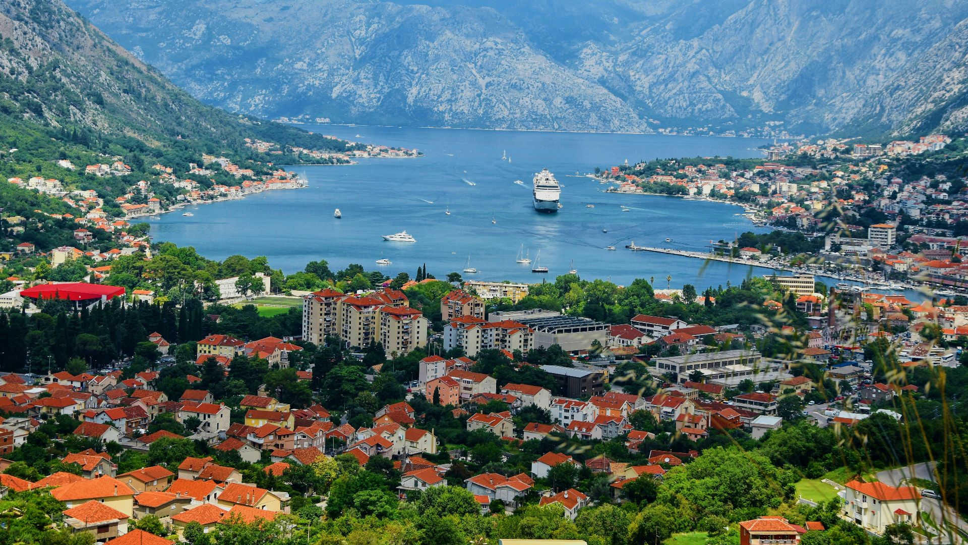 aerial view of city near body of water during daytime