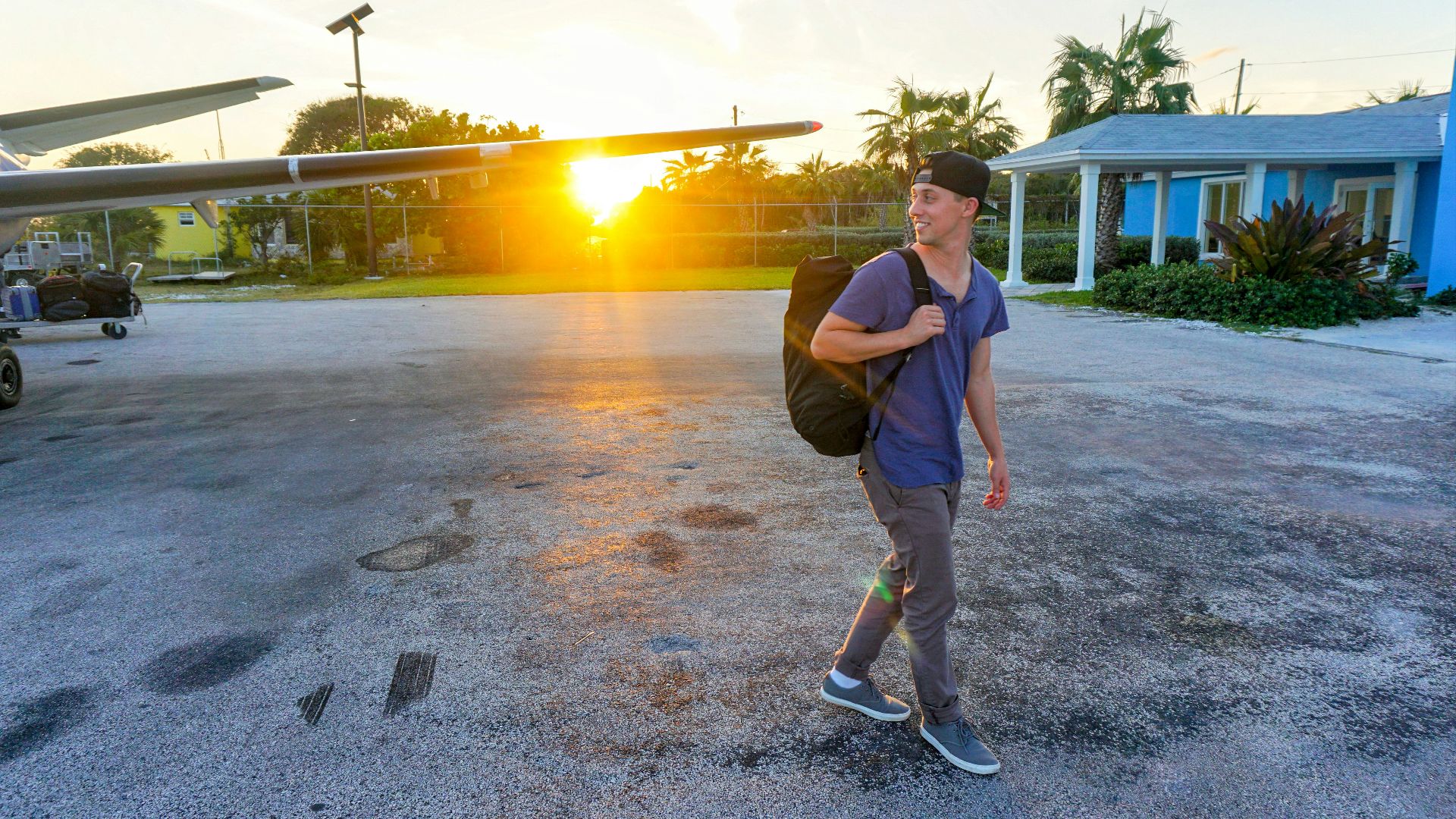 smiling man walking while looking side view