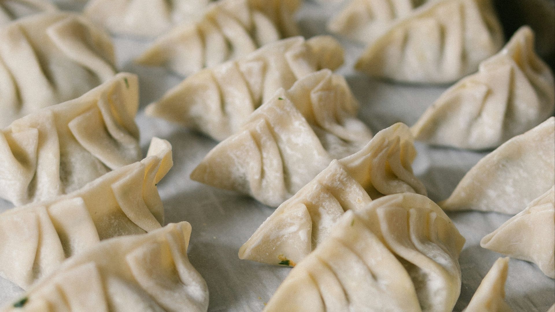 white textile on brown wooden table