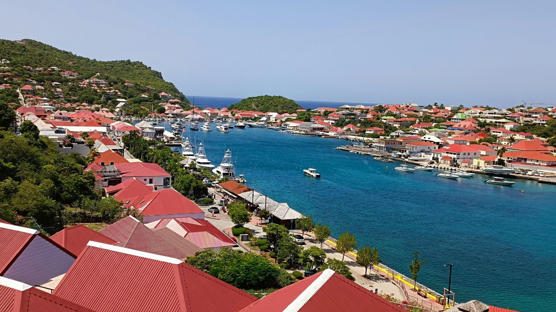 a view of a harbor with boats in the water