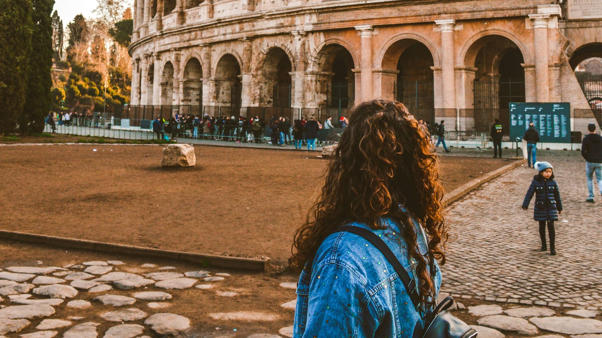 woman standing near Colosseum, Rome