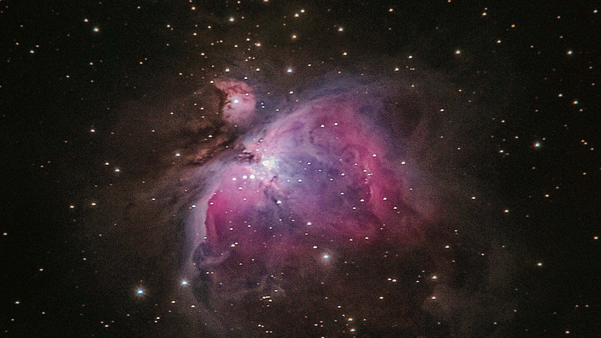 two stars in the middle of a black sky