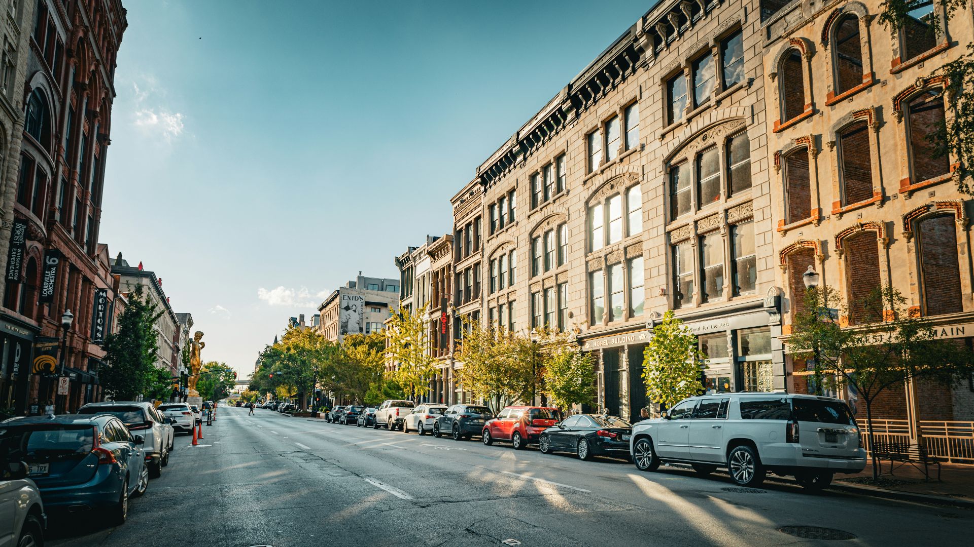 A city street filled with lots of tall buildings