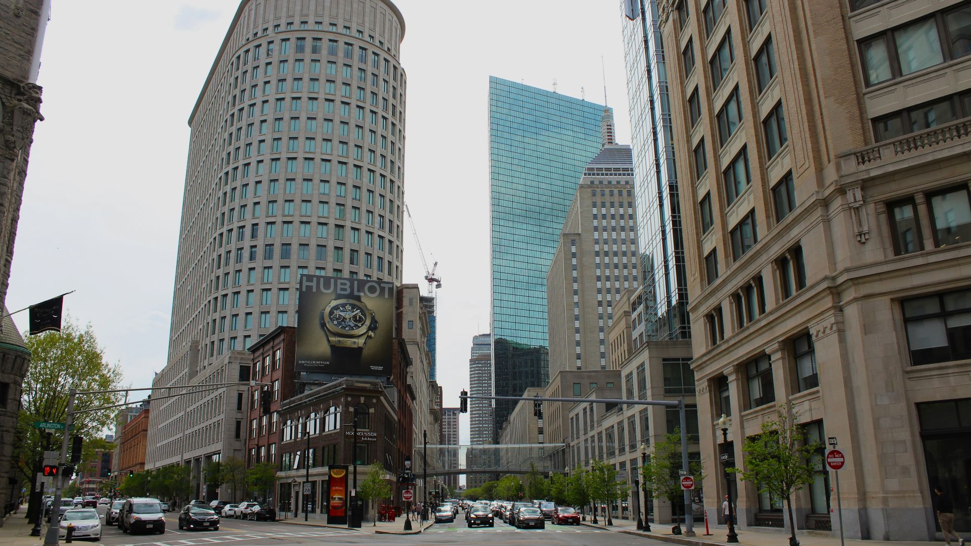 a street with cars and buildings on either side of it