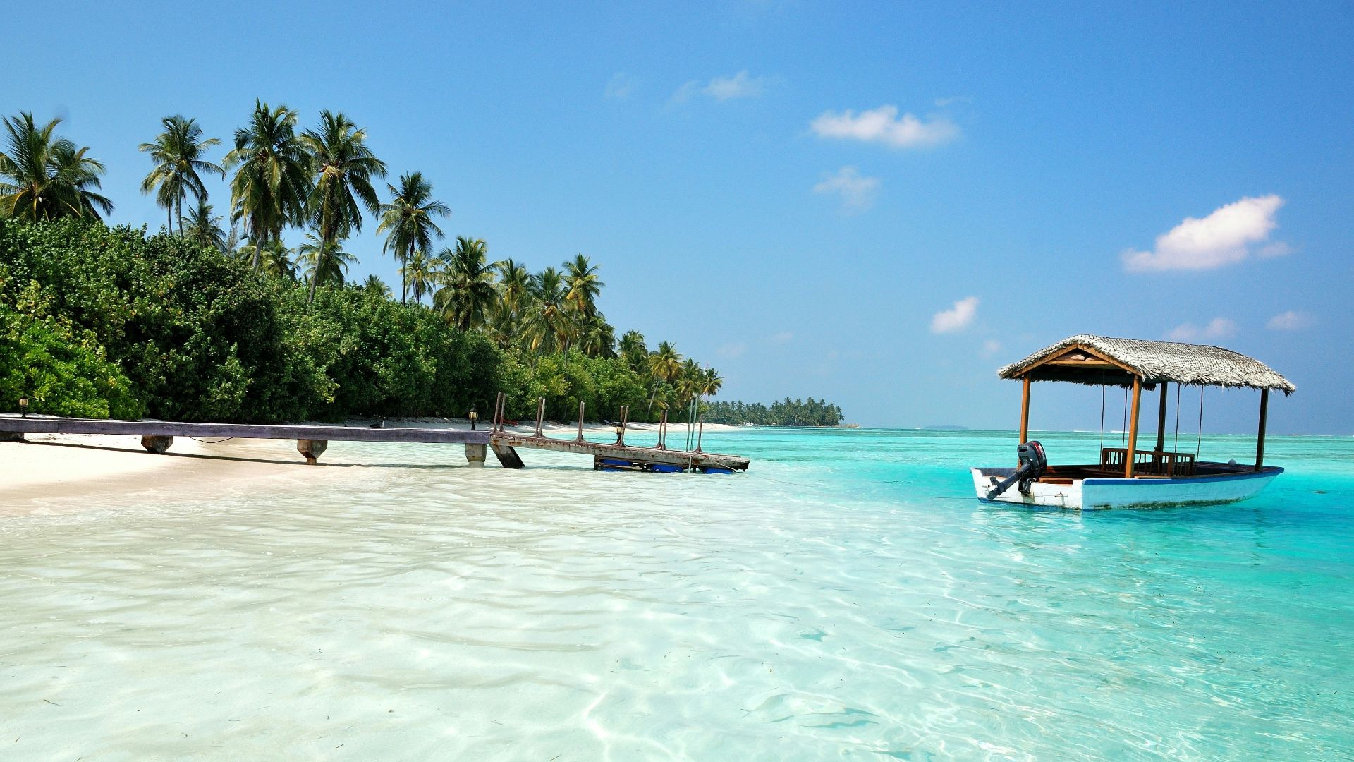 boat on body of water under cloudy sky