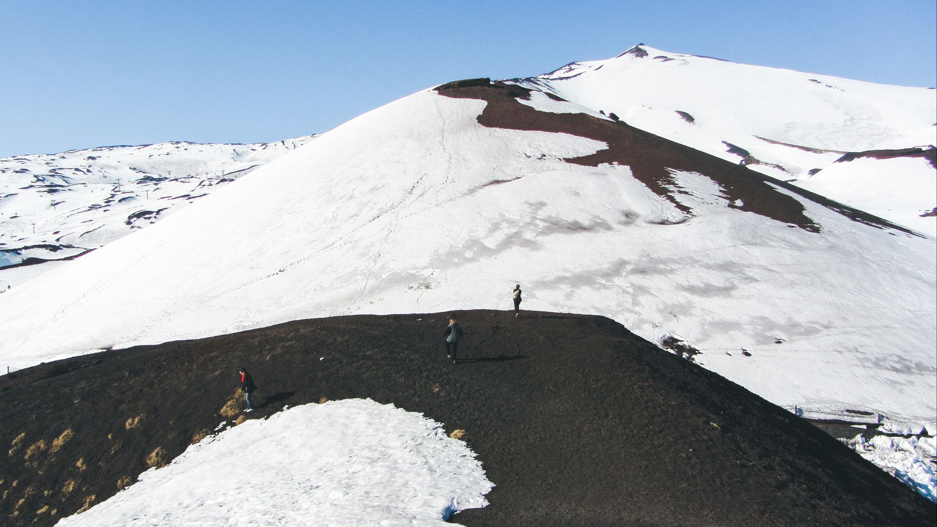 a group of people on a snowy mountain
