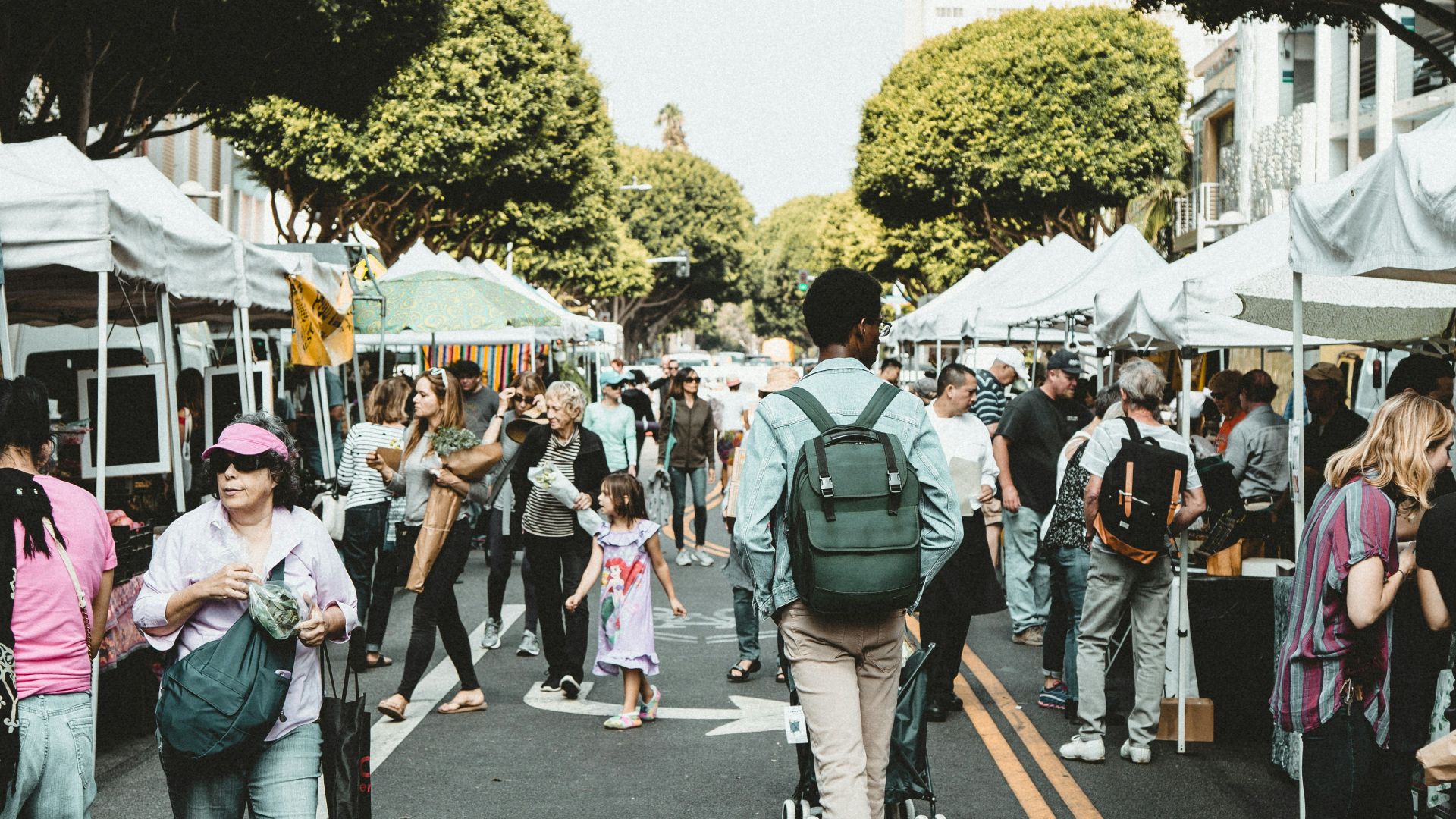 people walking on walkway during daytime