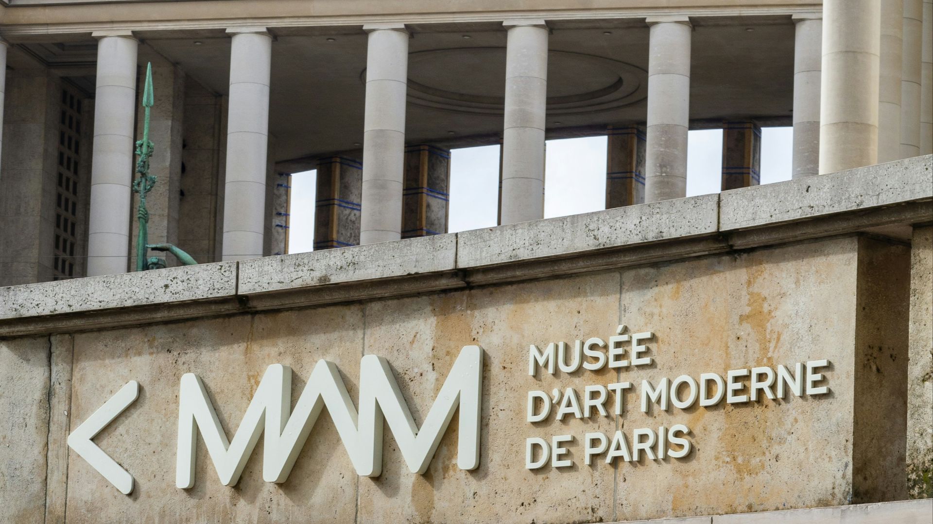 a building with a sign that says museum d'art moderne de paris