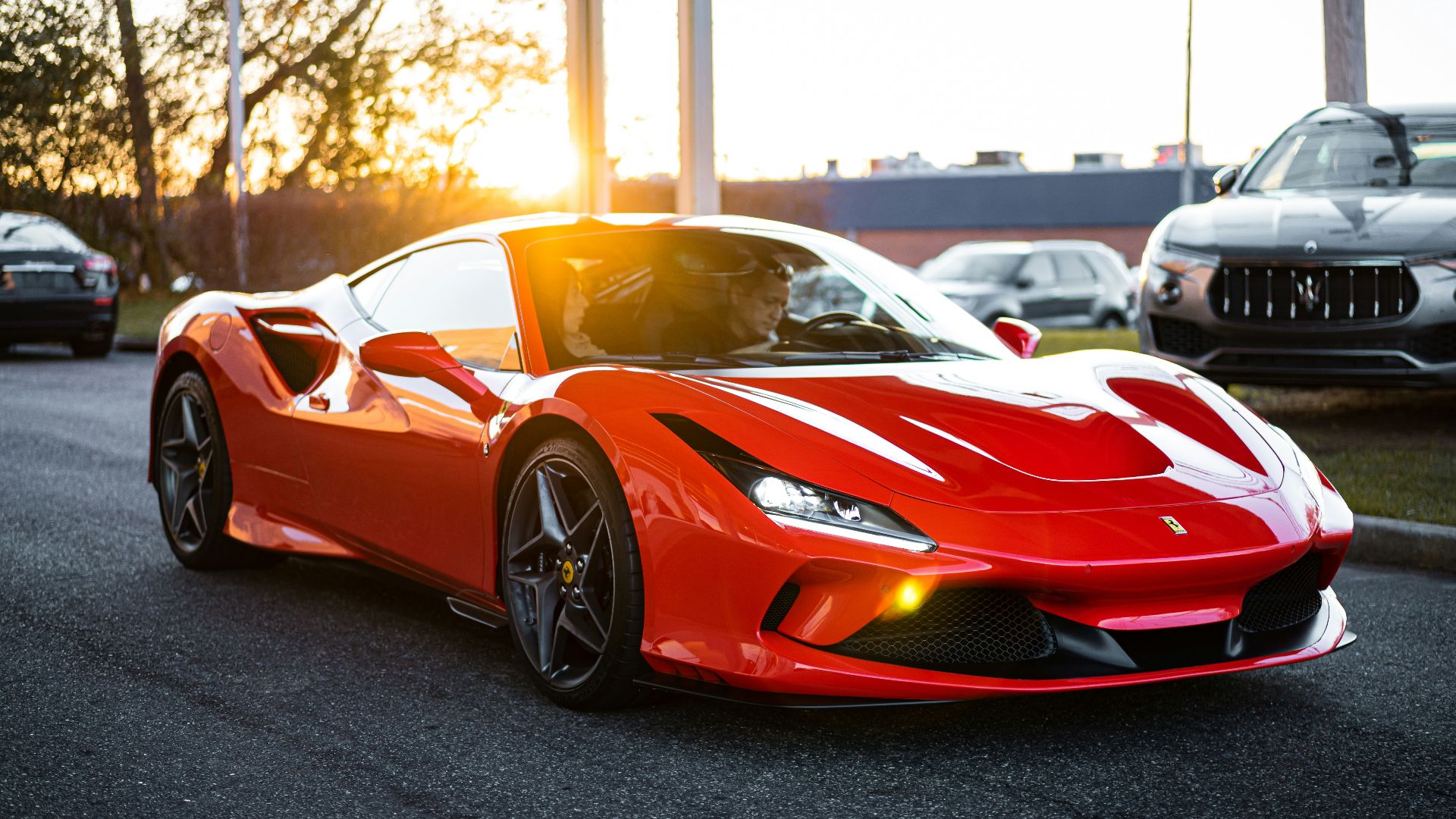 red ferrari 458 italia on road during daytime