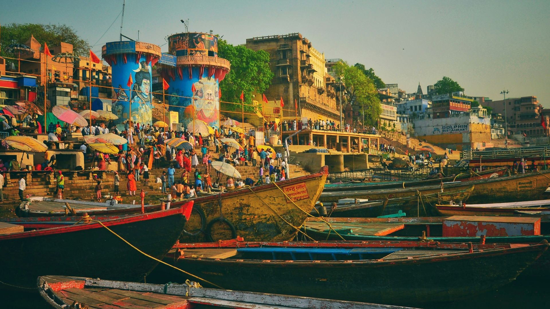 boat on dock near buildings during daytime