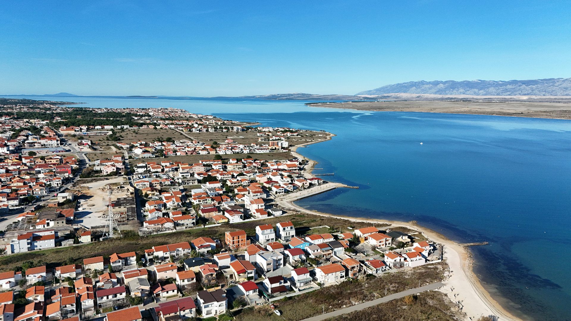 a bird's eye view of a small town by the water