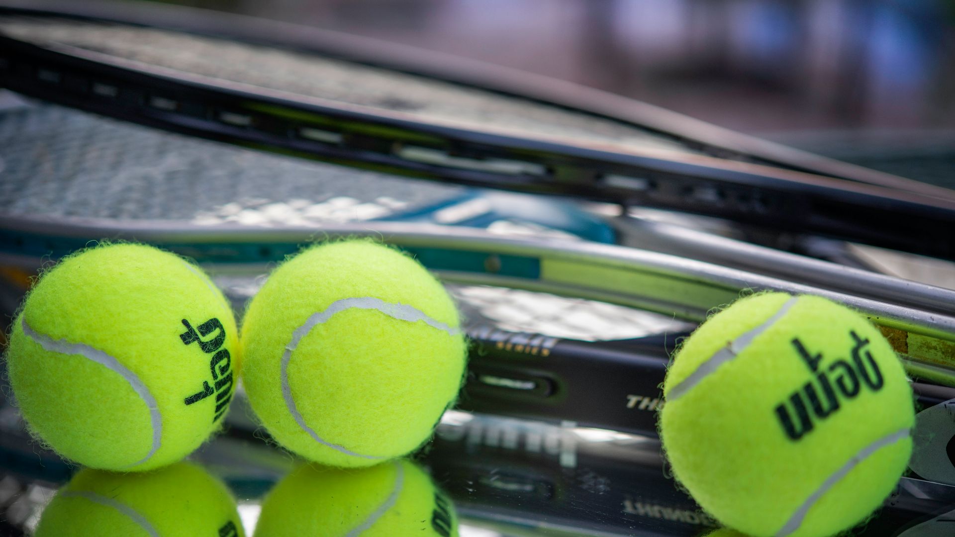 green tennis ball on black surface