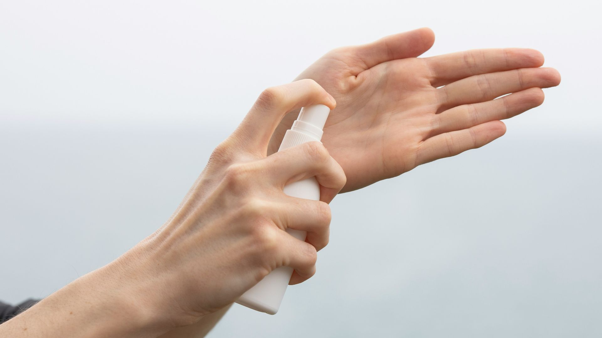 person doing hand sign during daytime