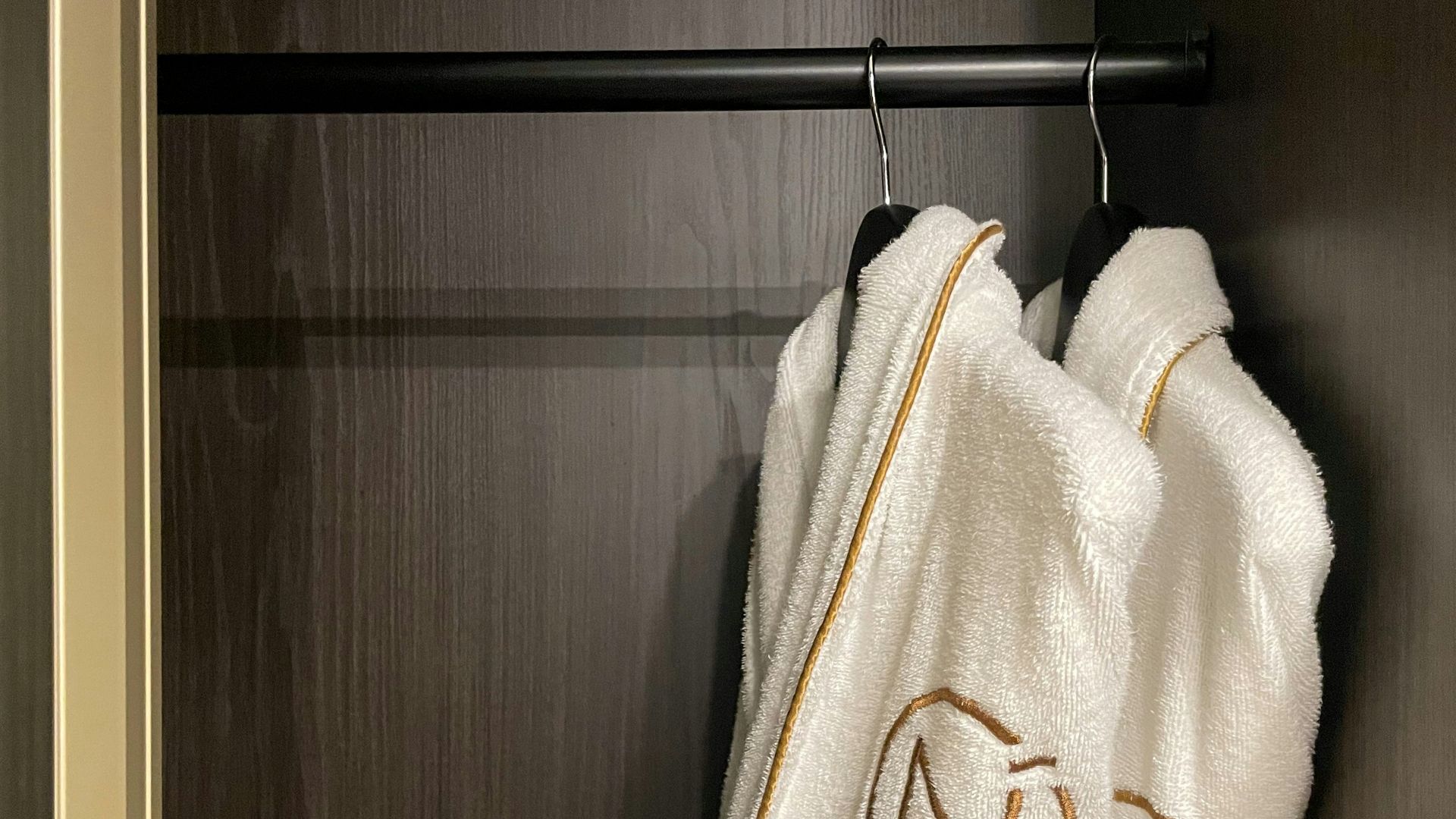 a towel hanging on a rack in a closet