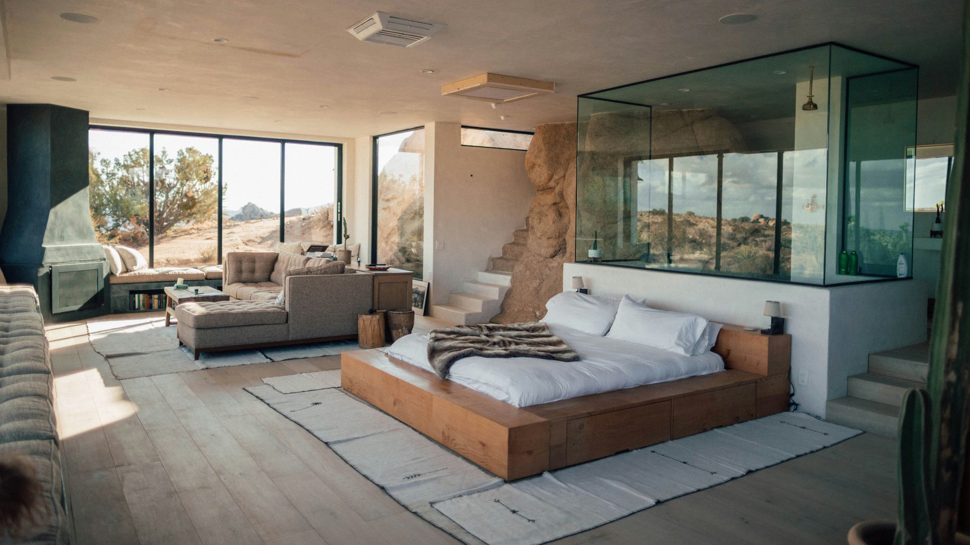 white mattress beside sectional sofa