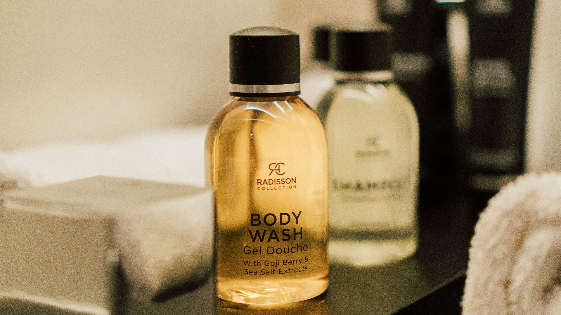 a close up of a bottle of soap on a table