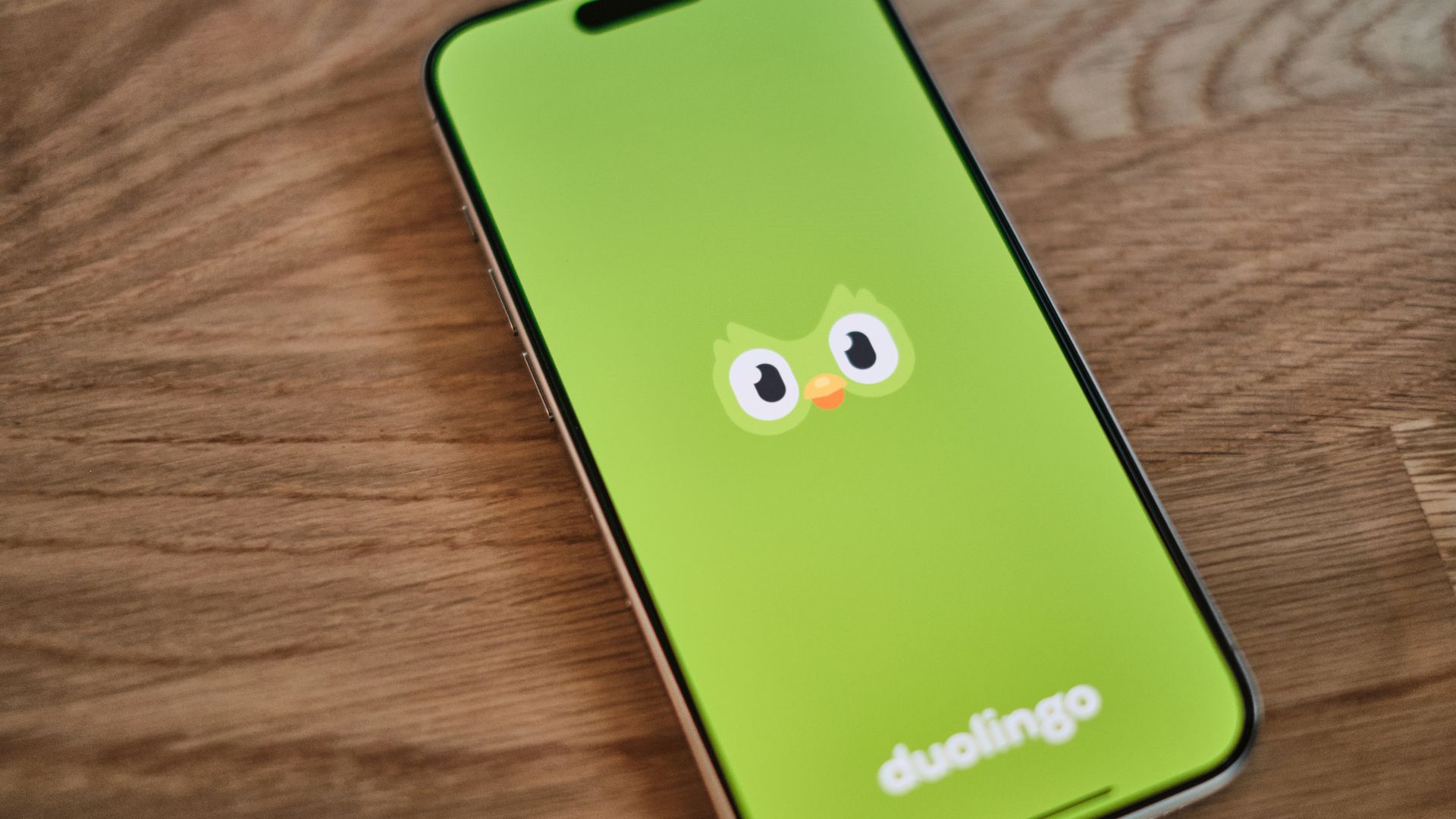 A green phone with a face drawn on it