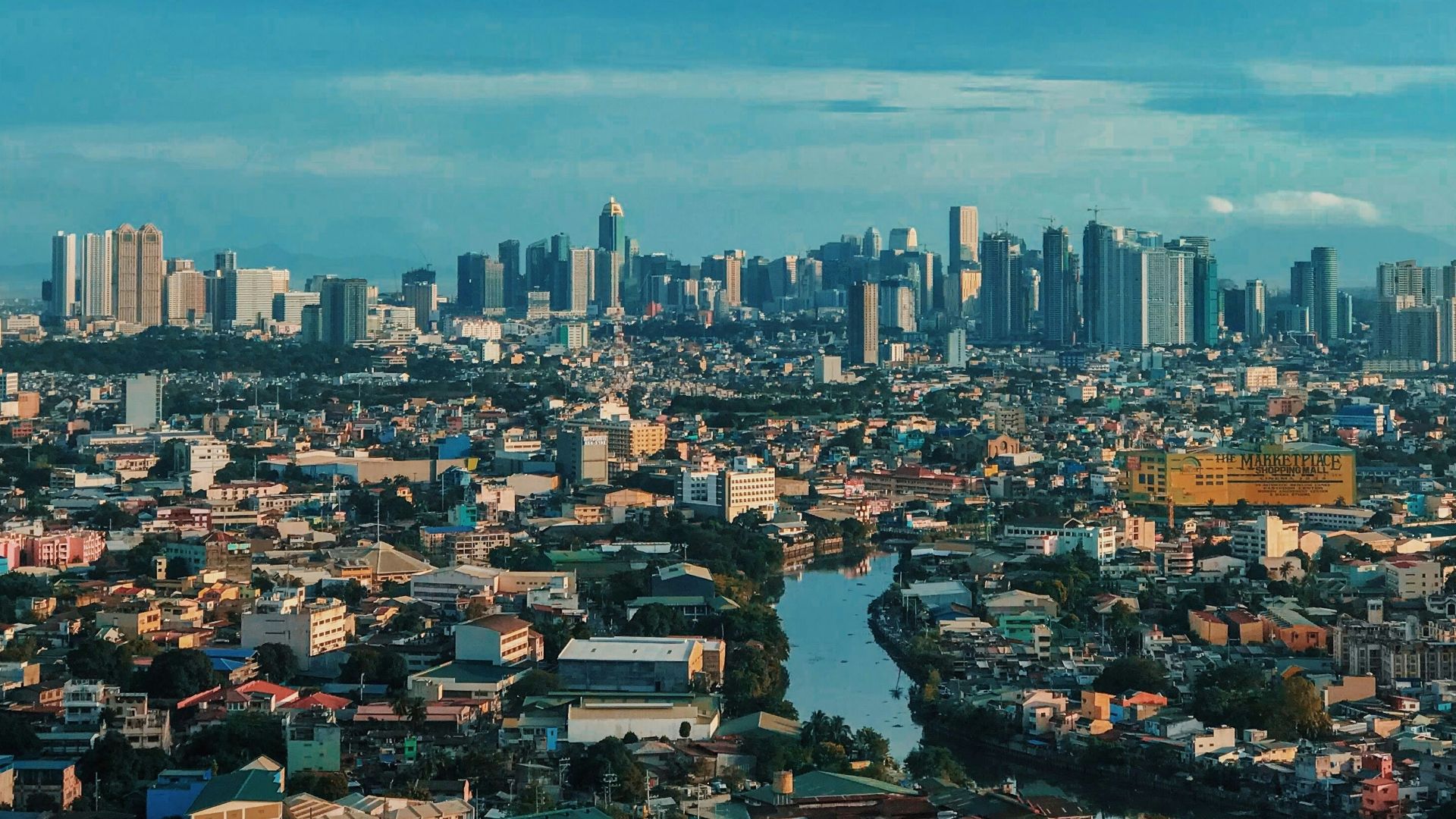 city skyline under blue sky during daytime