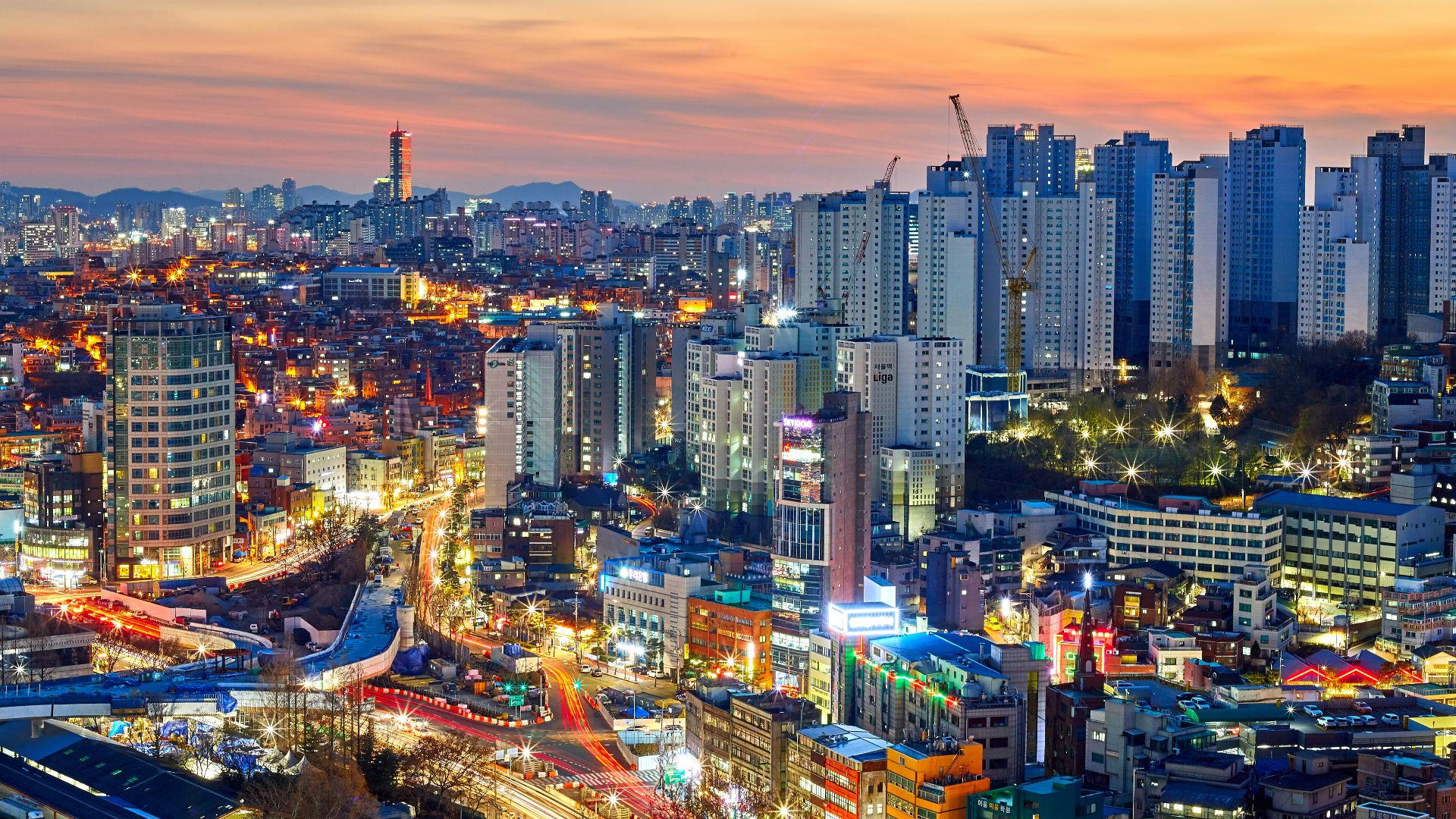 aerial photography of lighted city high rise buildings during dawn