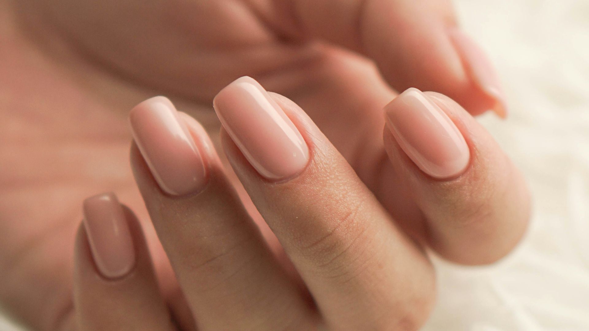 persons feet on white textile