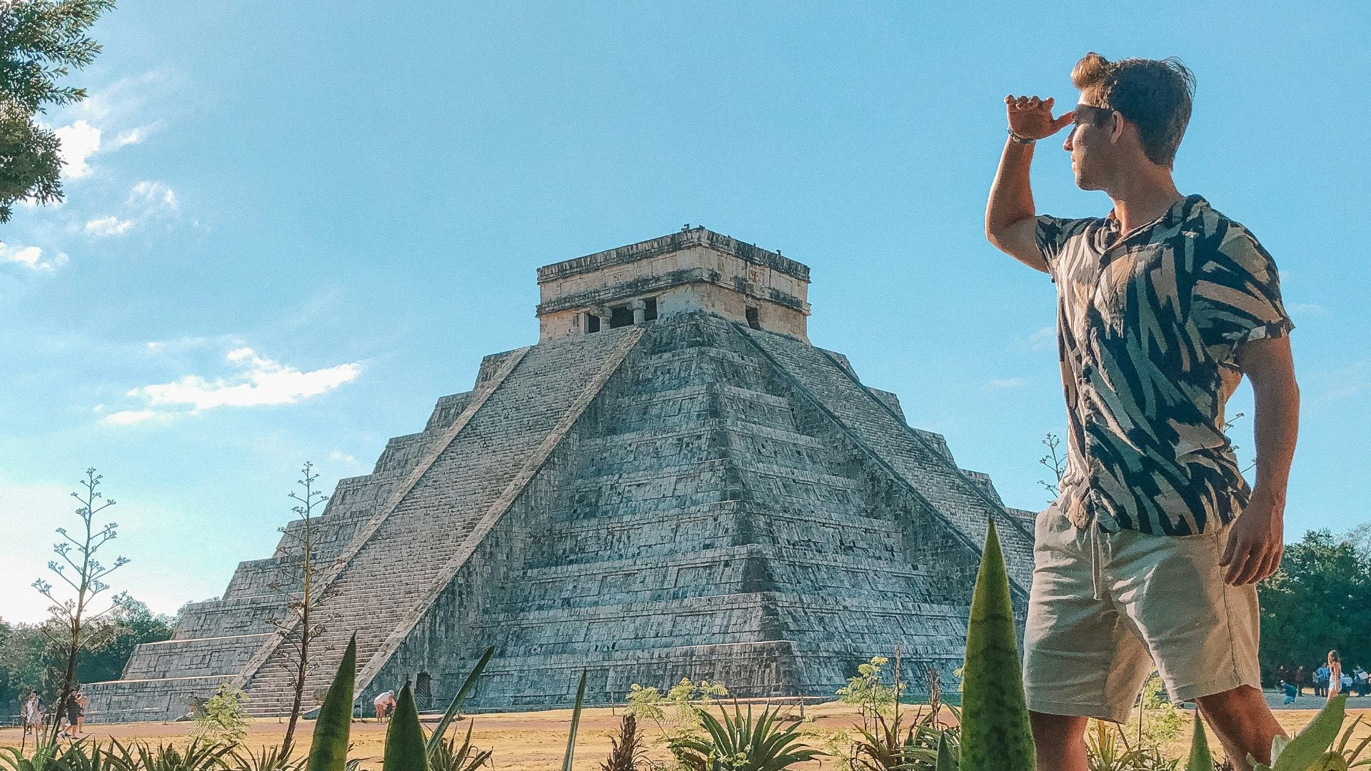 man standing in front of Chichen Itza, Mexico during daytime