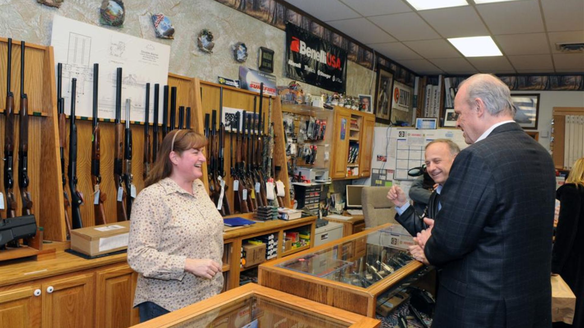 File:Checking out guns at the gun shop (2141288110).jpg
