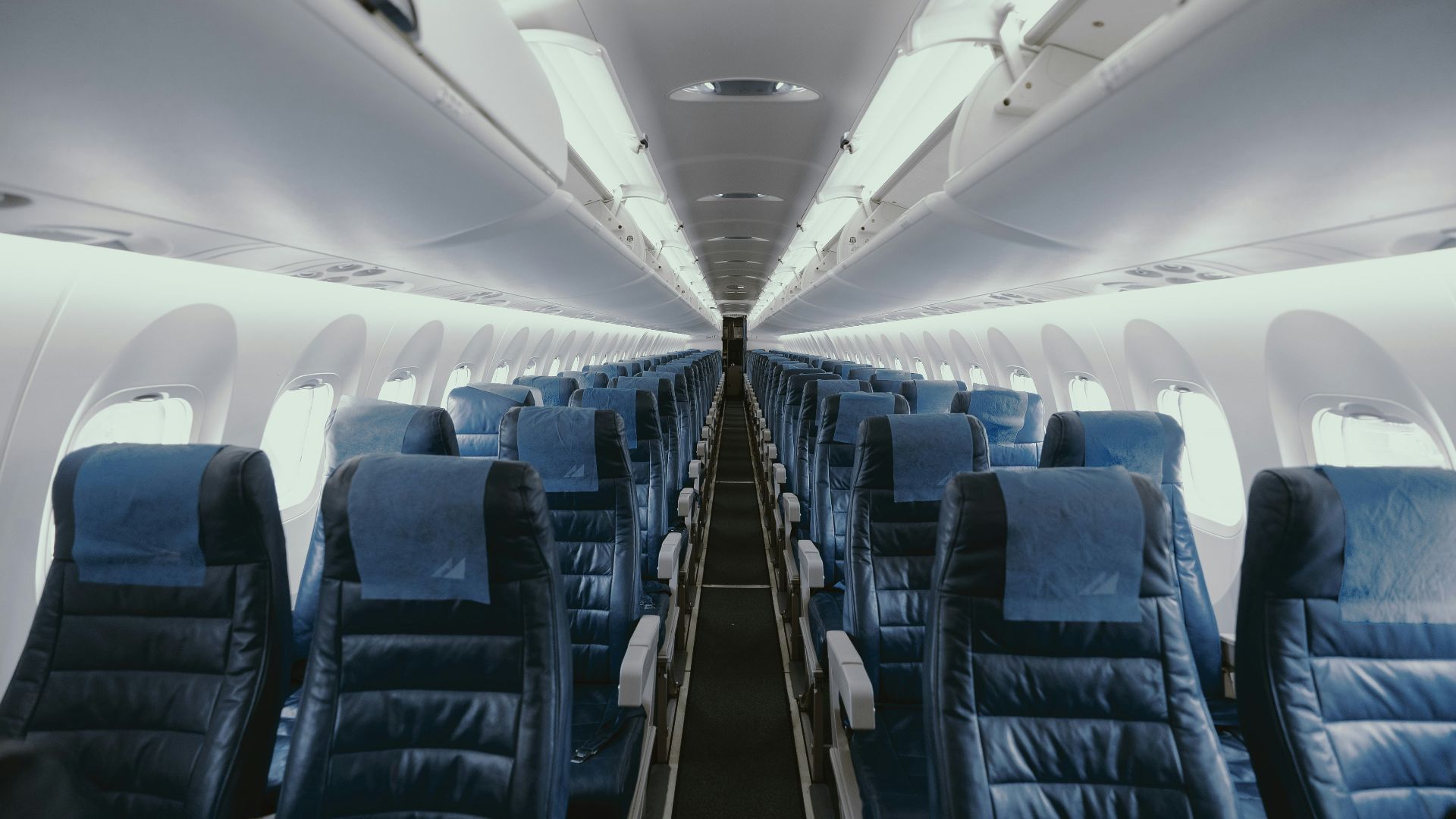 blue airplane interior with seats
