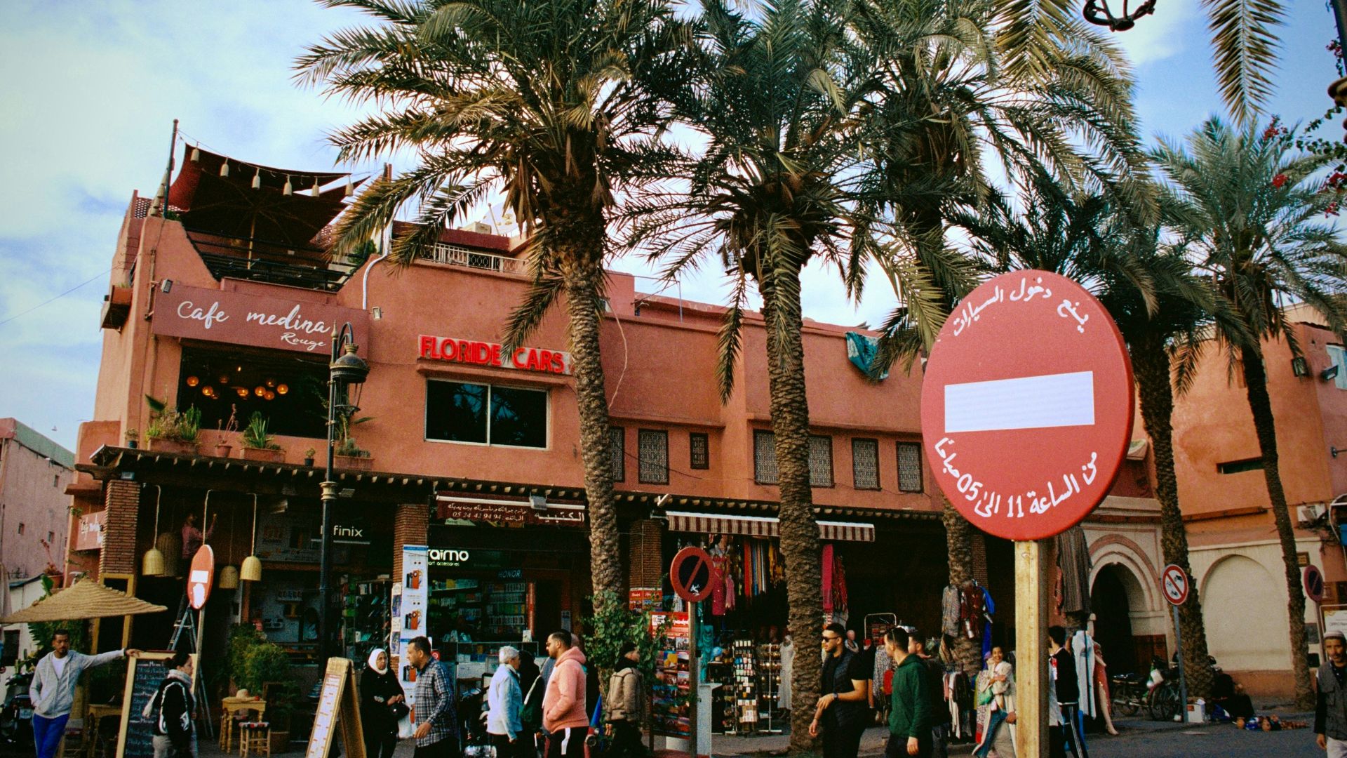 a group of people standing outside of a building