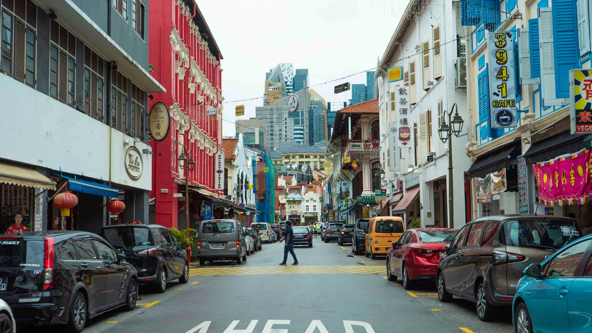 a street with cars parked on both sides of it
