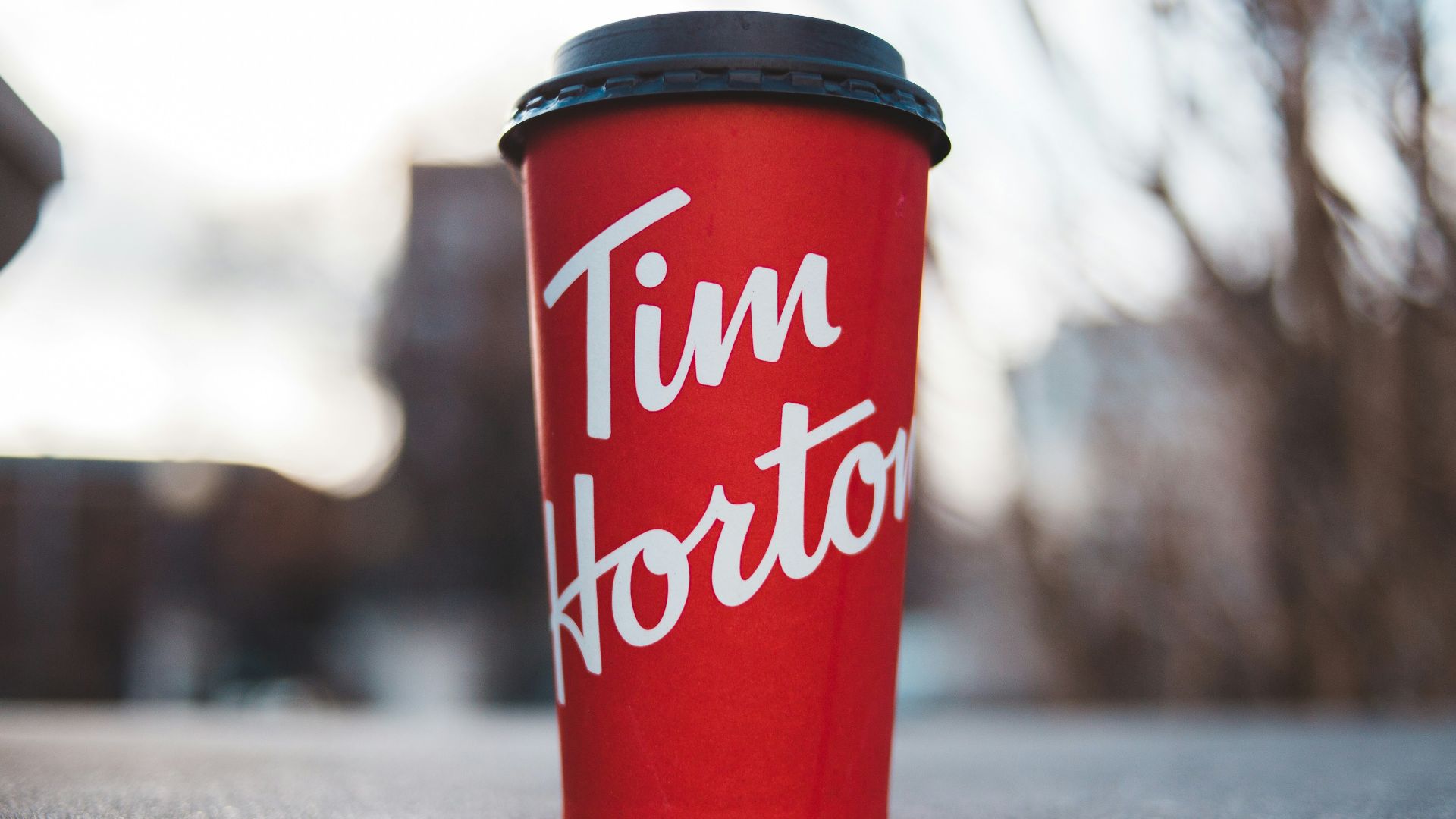 red and white plastic cup on gray concrete floor