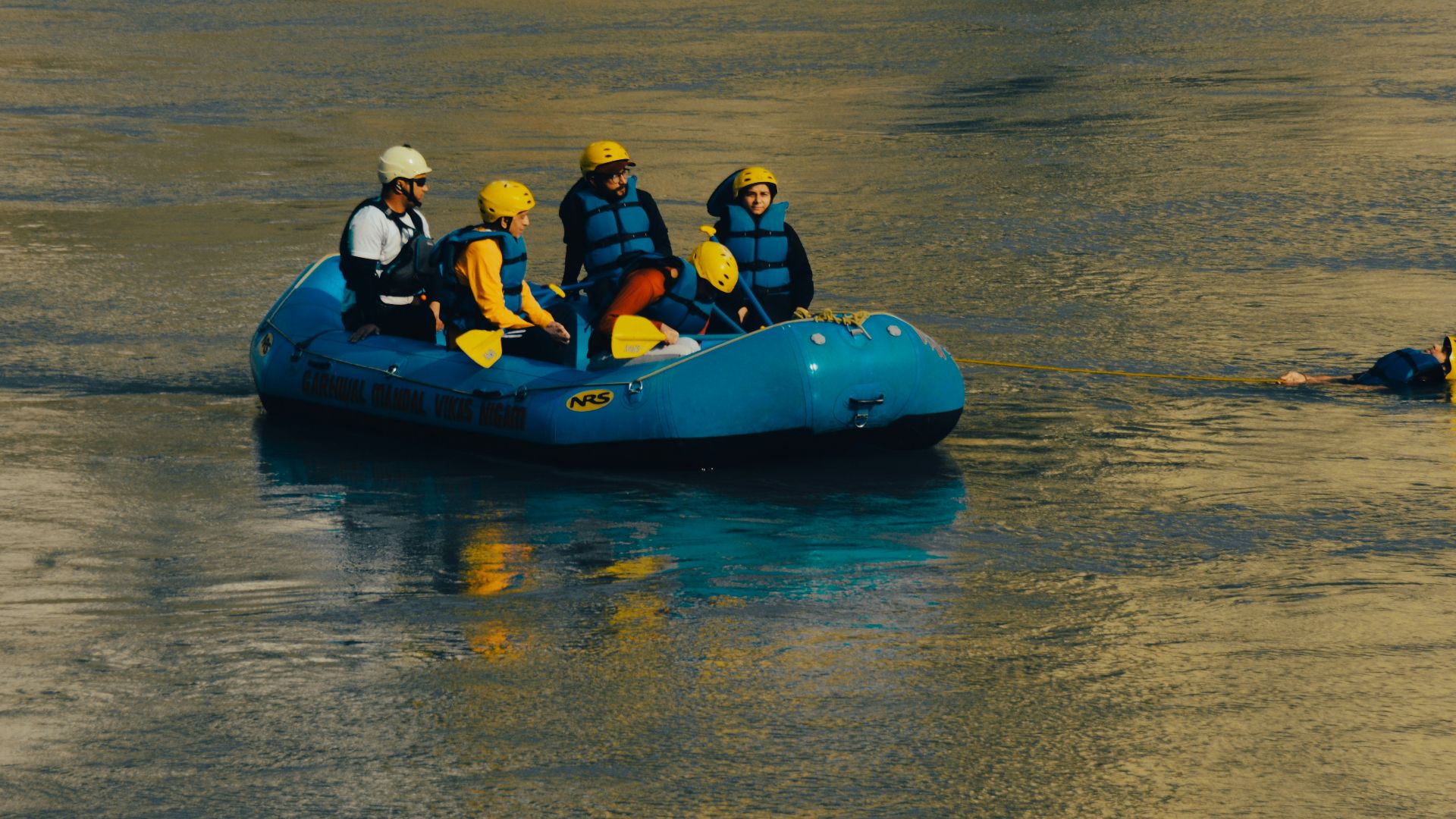 a group of people on a raft in the water