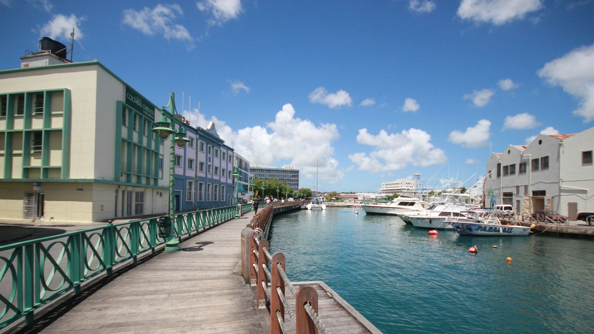 white and green boat on dock during daytime