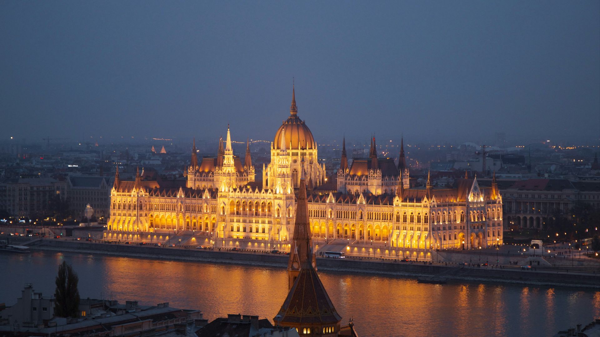 white and brown dome building near body of water during night time
