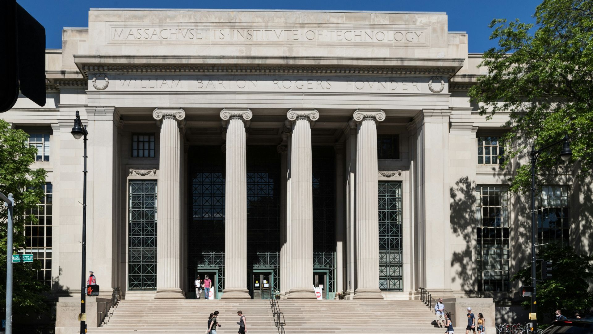 a large white building with columns with Pushkin Museum in the background