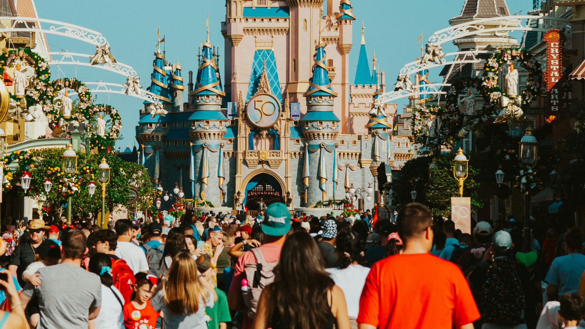 a crowd of people in front of a castle