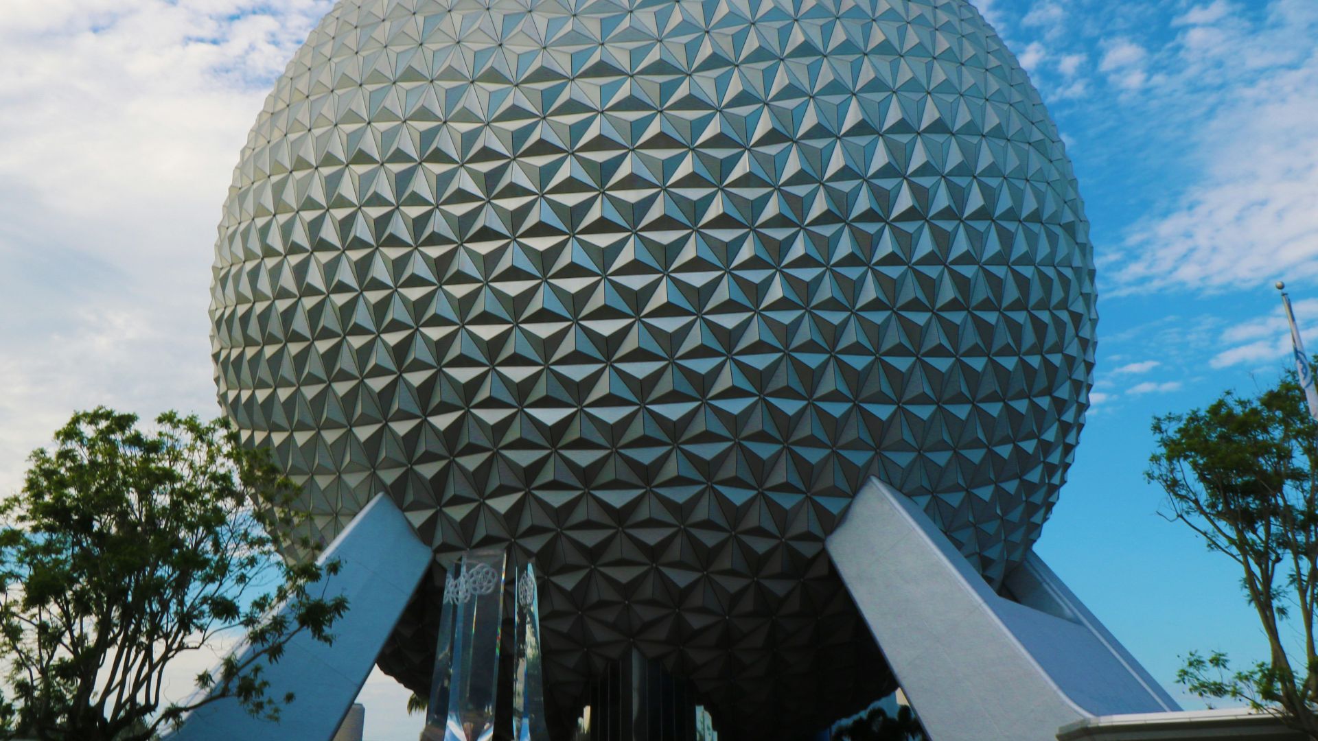 A large ball sitting in front of a building