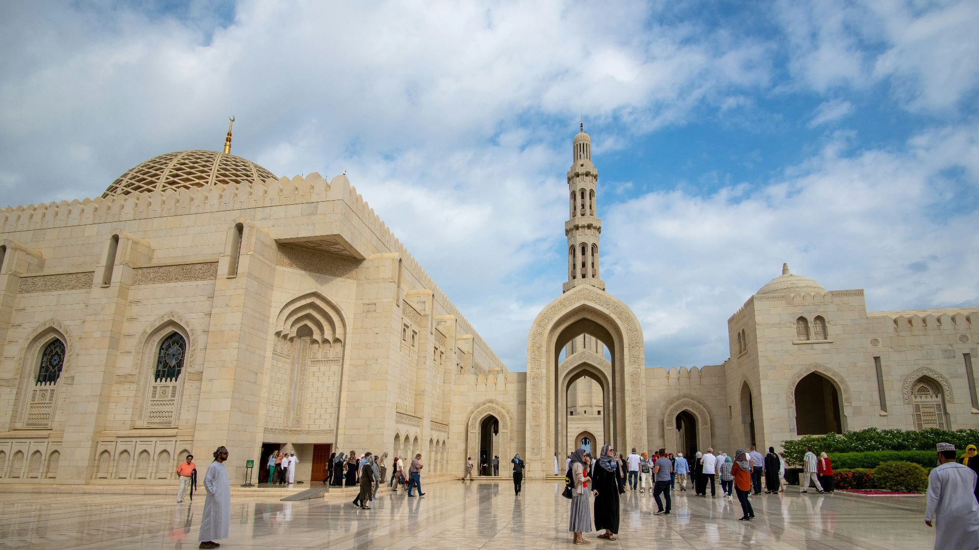 people walking near beige concrete building during daytime