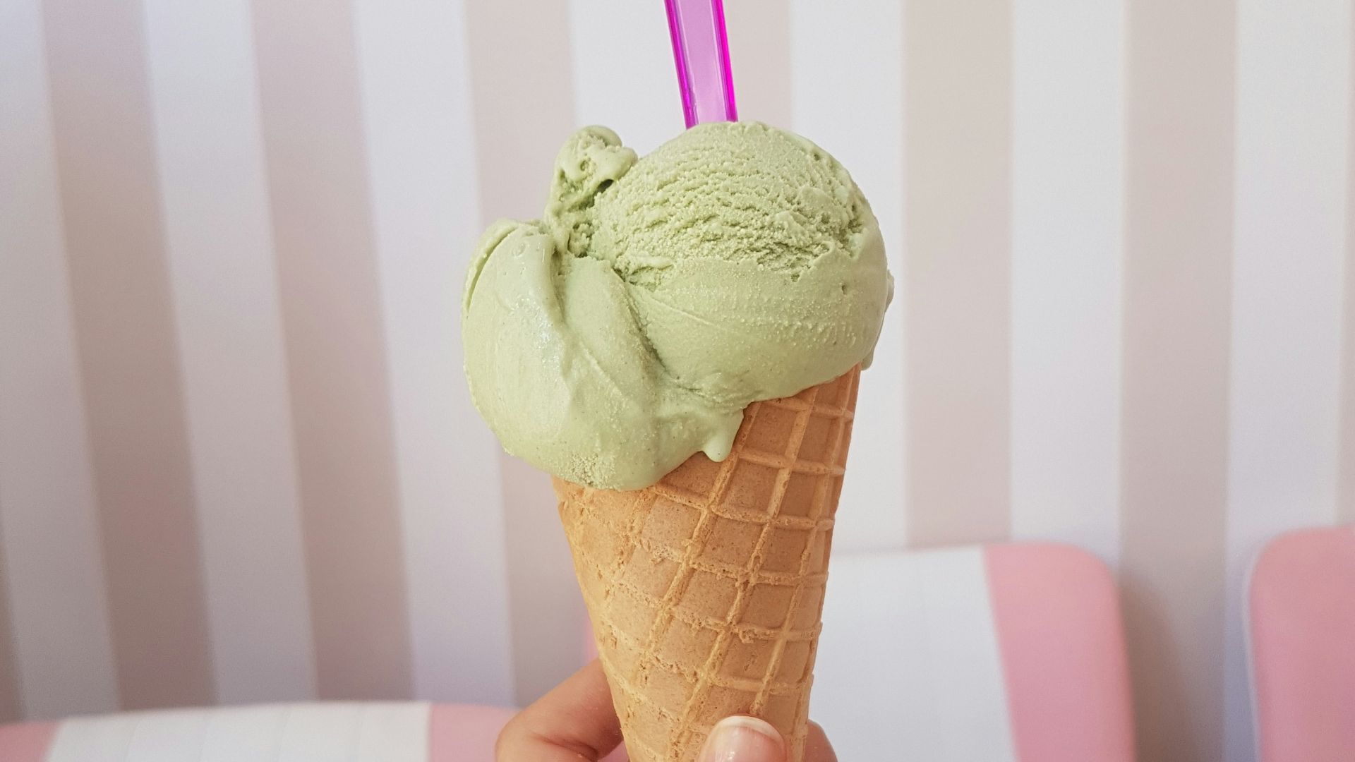 woman holding green ice cream