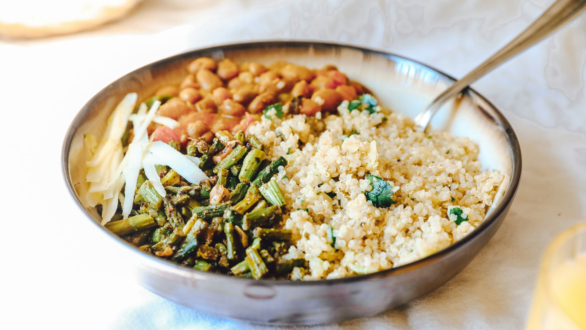 cooked rice with green peas and carrots on stainless steel bowl
