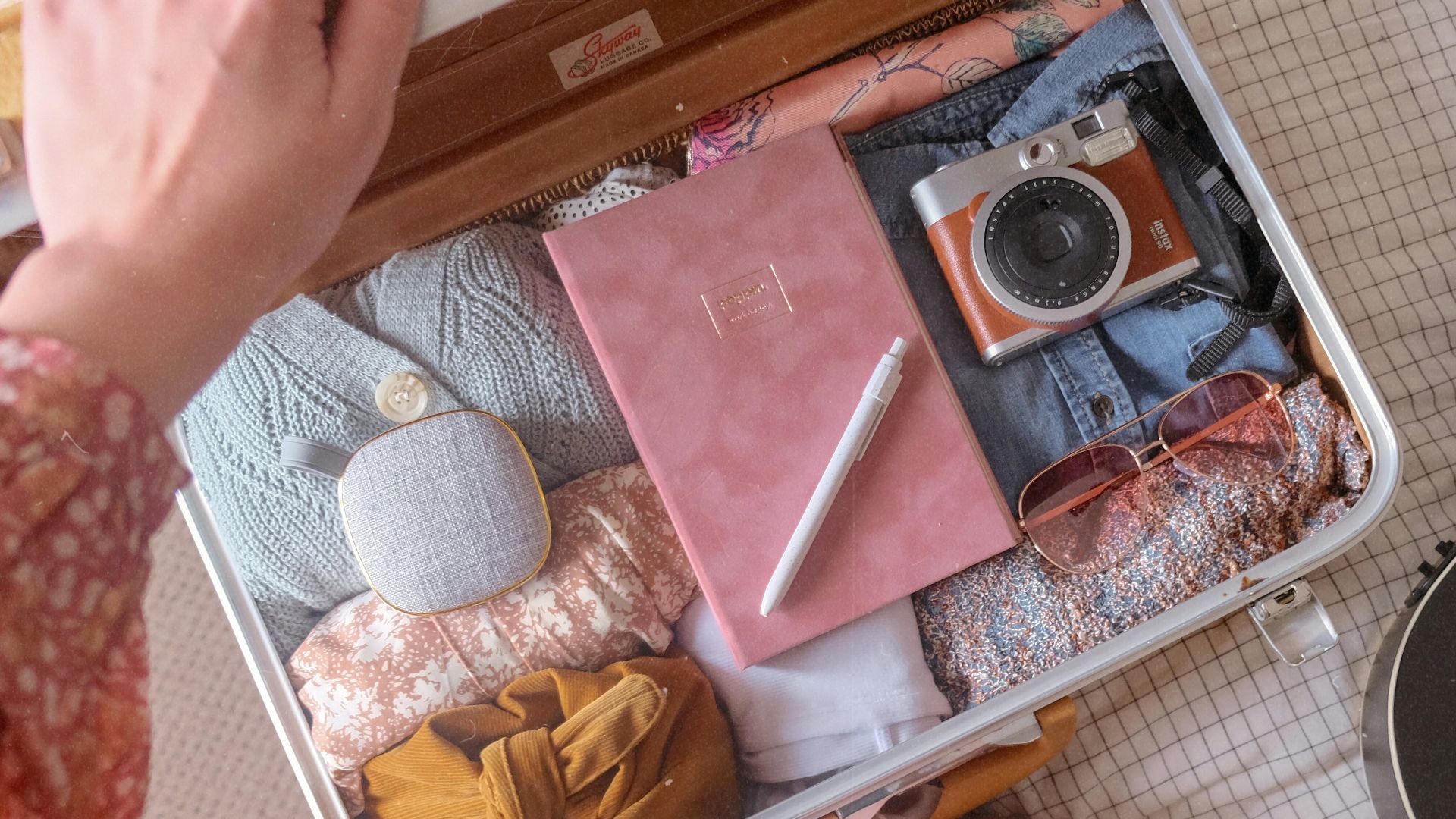 a person sitting on the floor next to a guitar