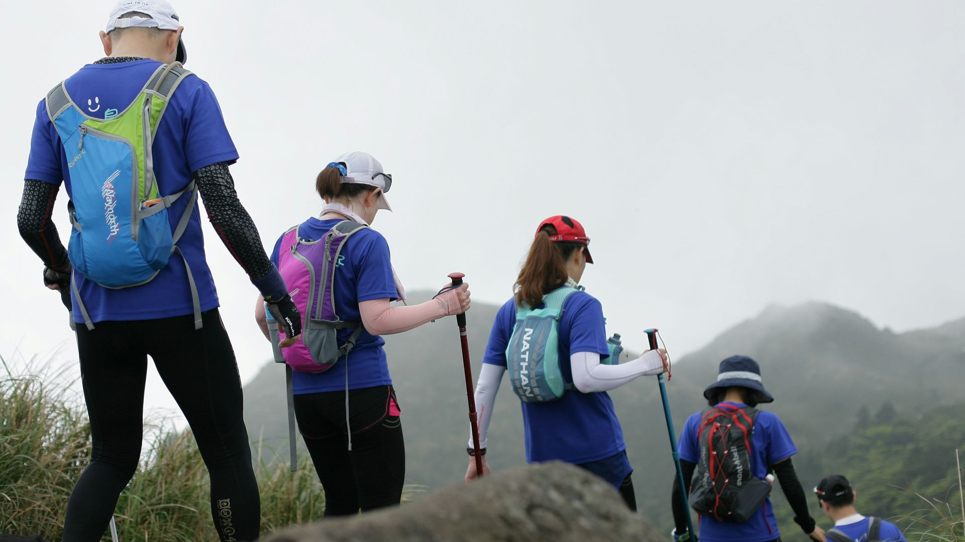 people standing on rock during daytime