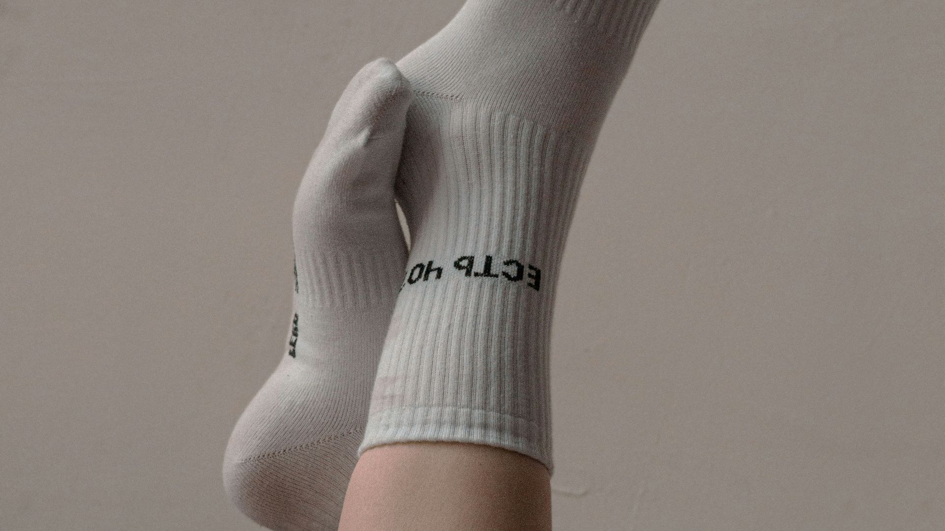 person wearing white nike sock