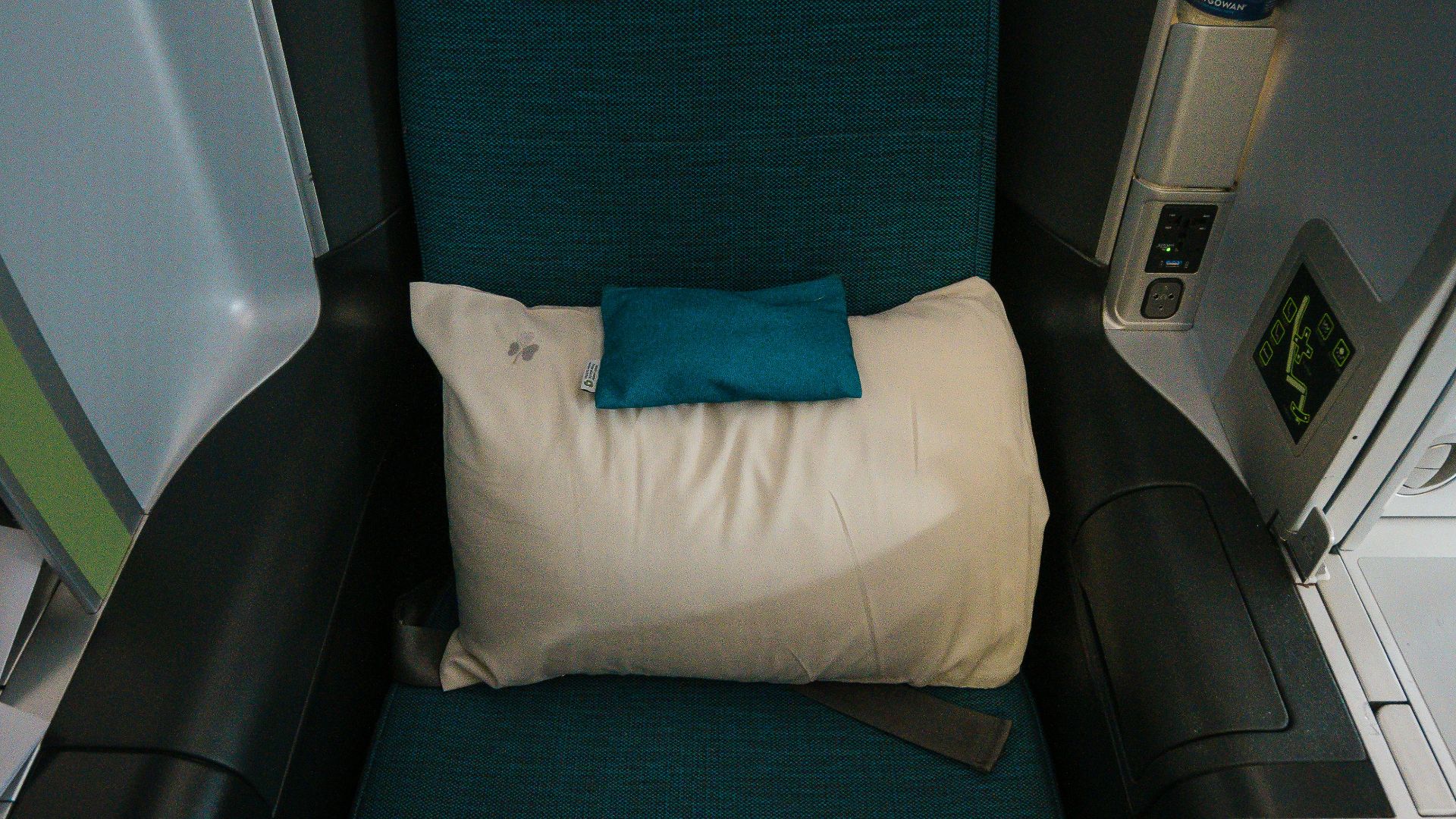 a seat on an airplane with a pillow on it