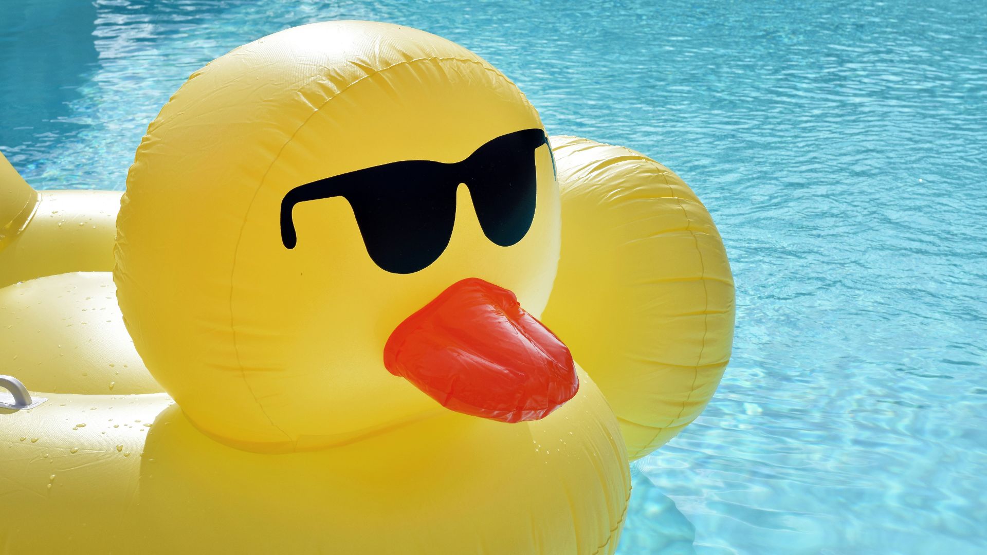 yellow inflatable balloon floating on water