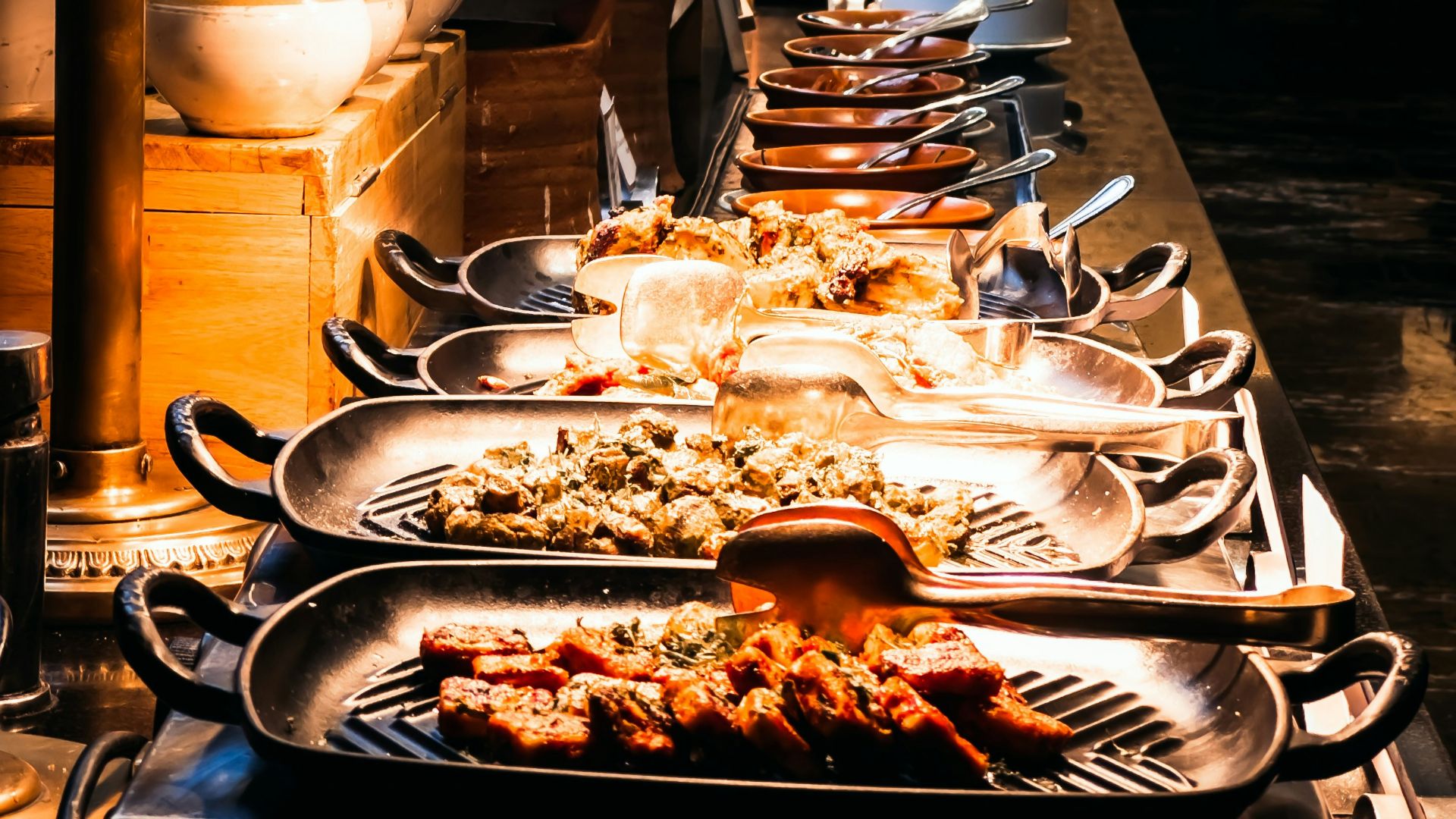a buffet table with many plates of food on it