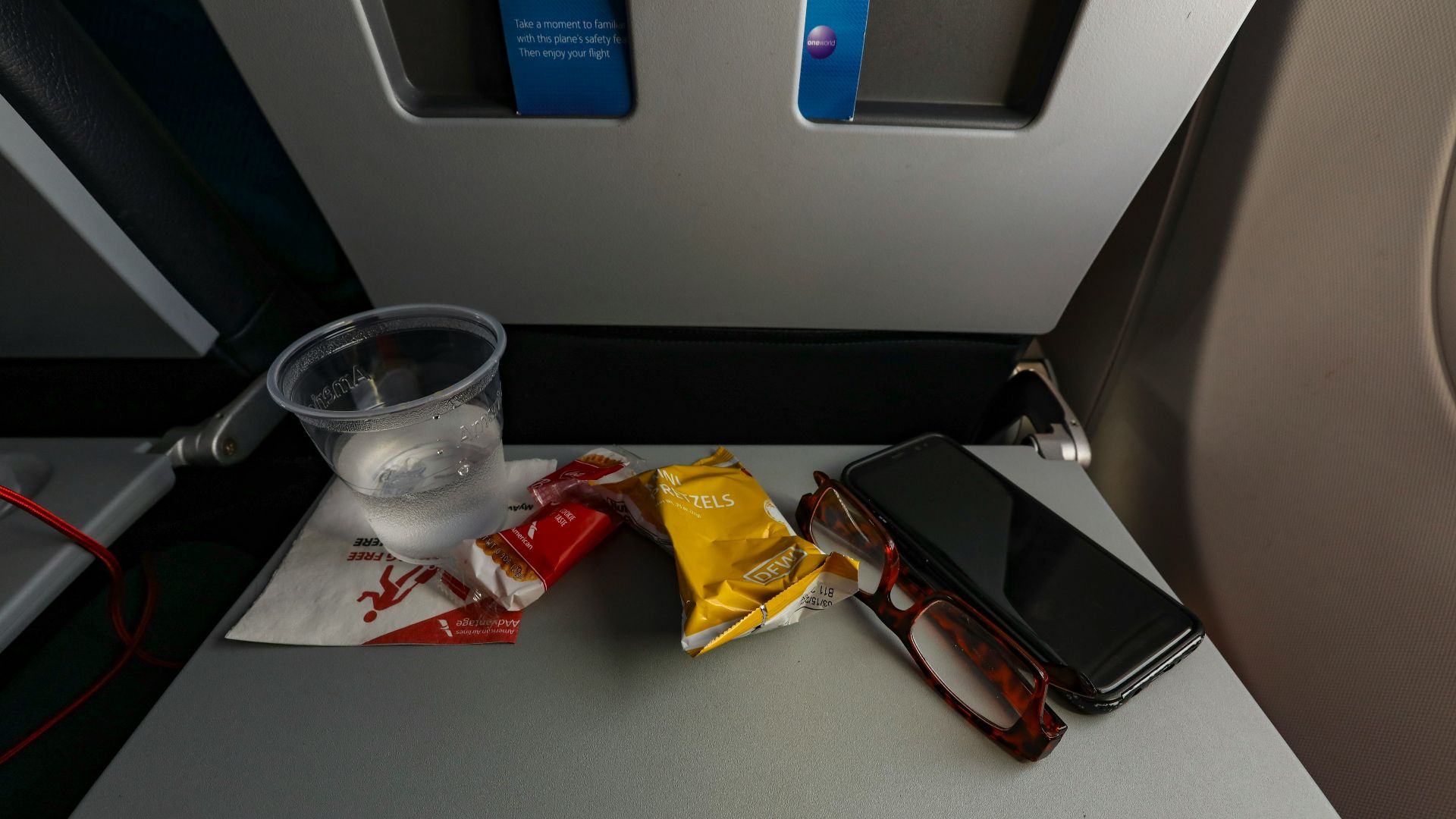 a table with a cell phone and some snacks on it