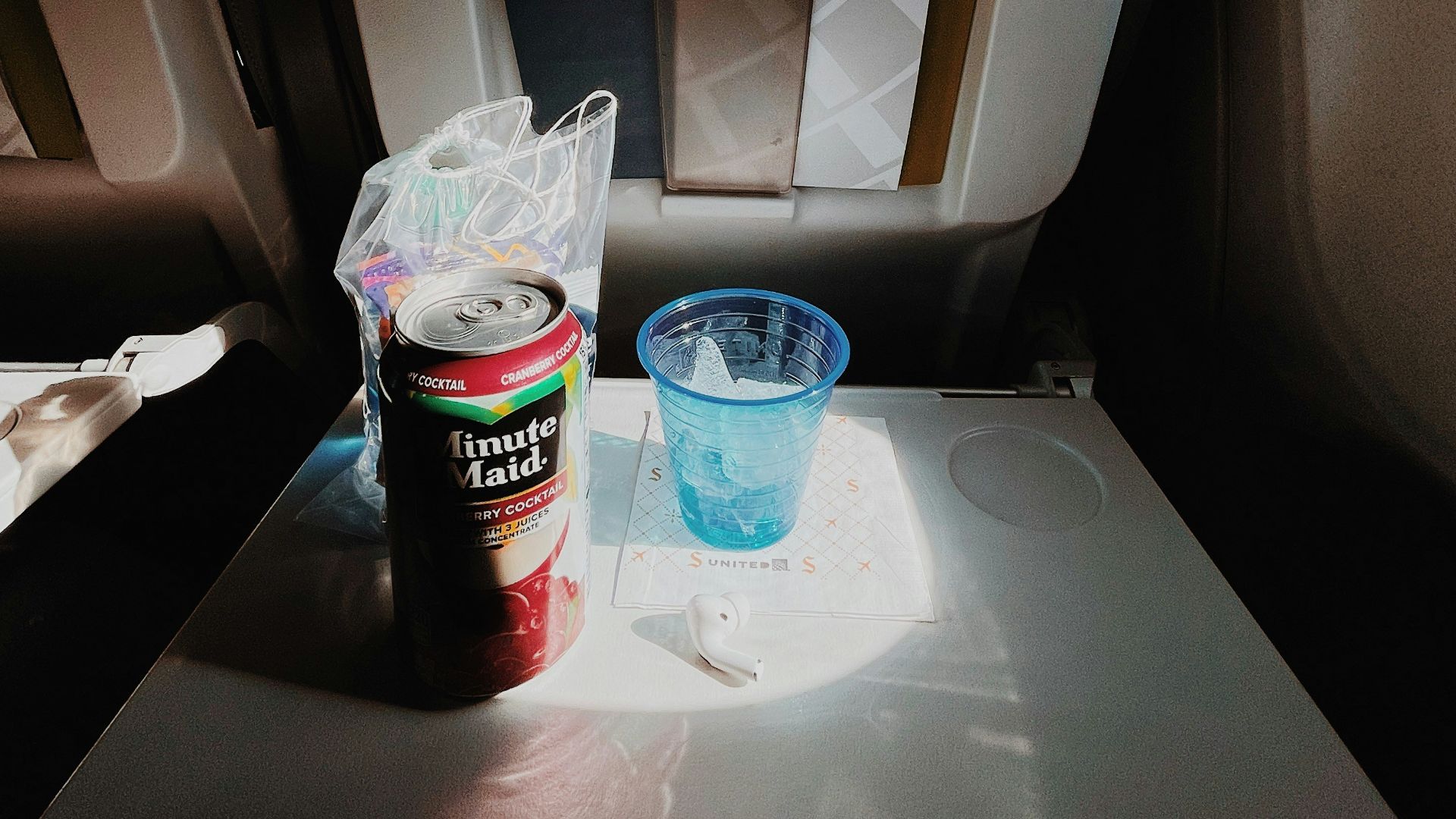 white and black plastic cup on white plastic container