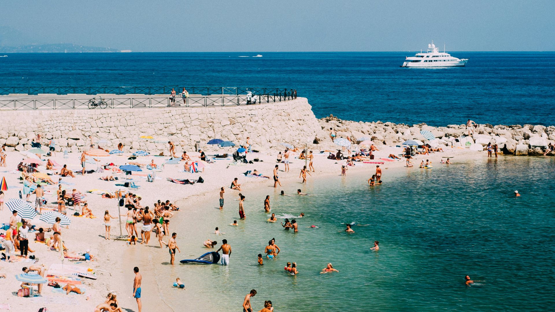 people standing on seashore