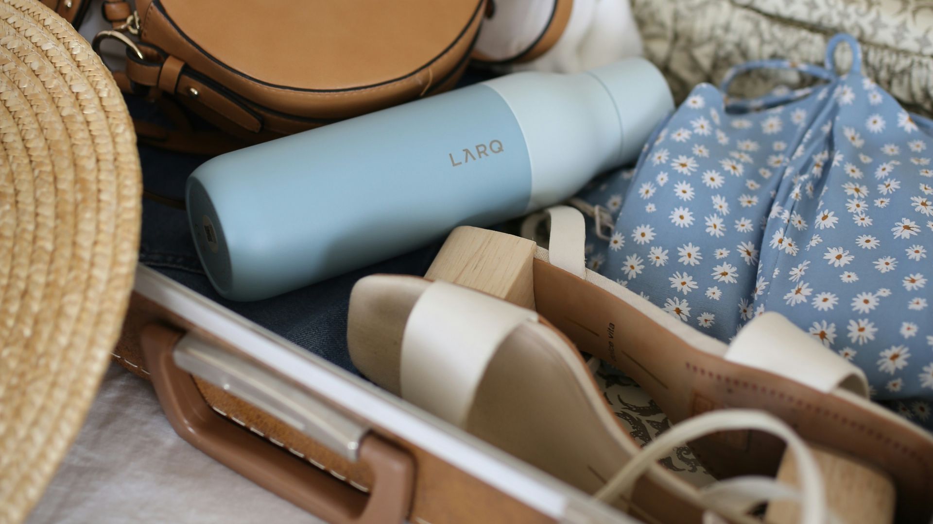 brown and gray leather suitcase